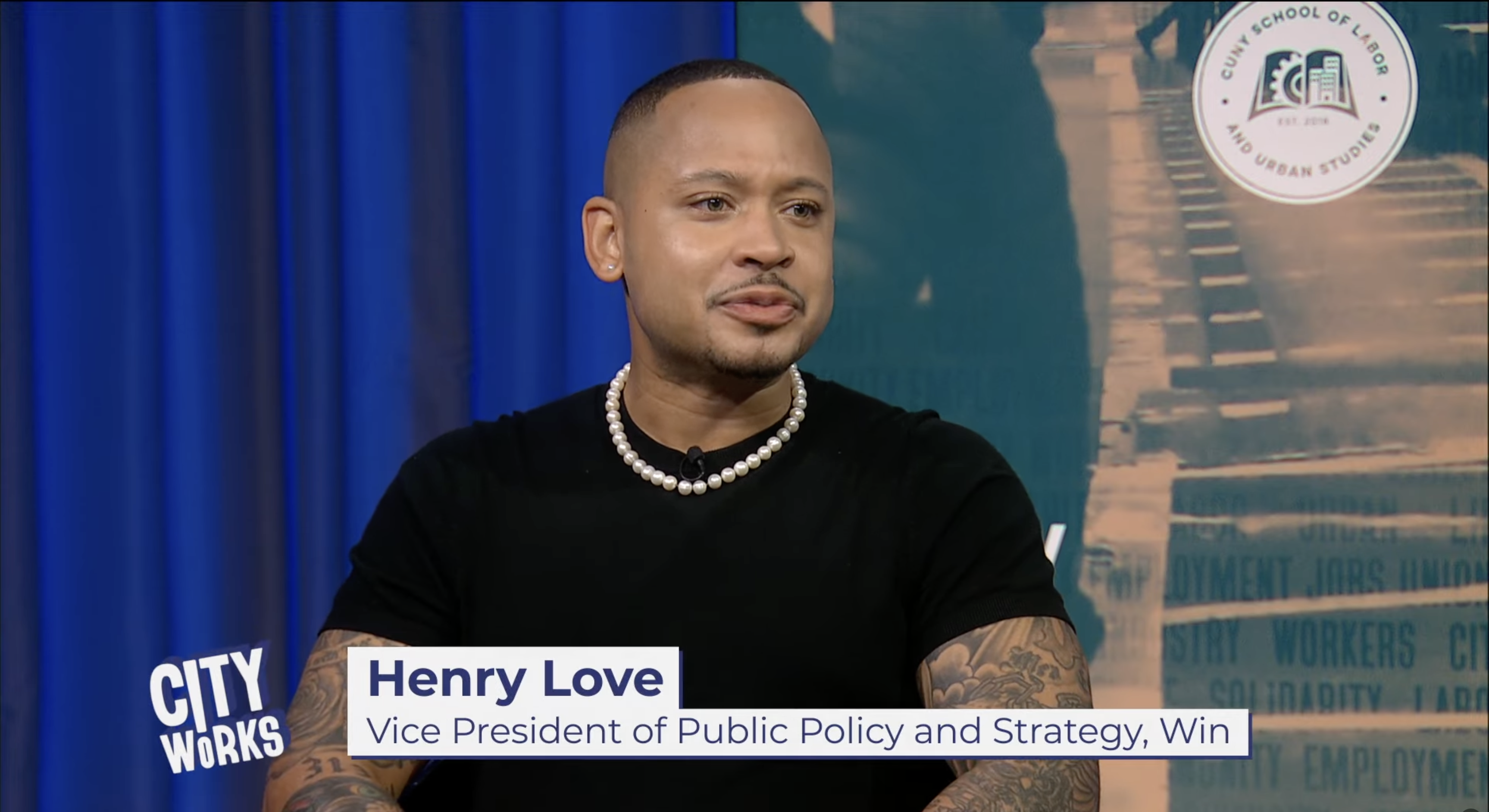Screen shot of Henry Love speaking.